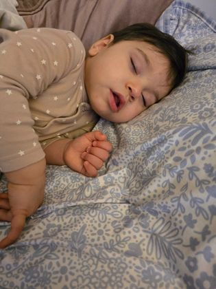 Night sleep wearing pampers nappies 