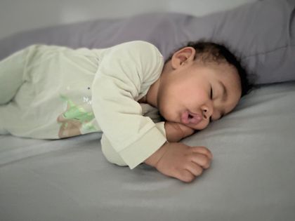 Night time and yes wearing Pampers 